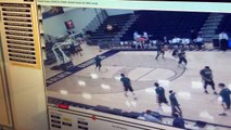 Basketball player destroys backboard with a dunk... in warmups!