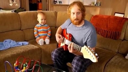 Baby Rock-n-Roller Holds Forth on the Guitar