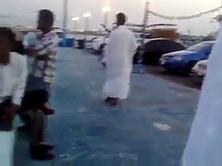 The boy put down into the sea by arabic man very funny