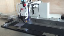 Large area automatic pattern sewing machine for aircraft arrestor tapes