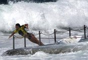 Tyler Wright smashes into a rock pool during surfing event in Cronulla