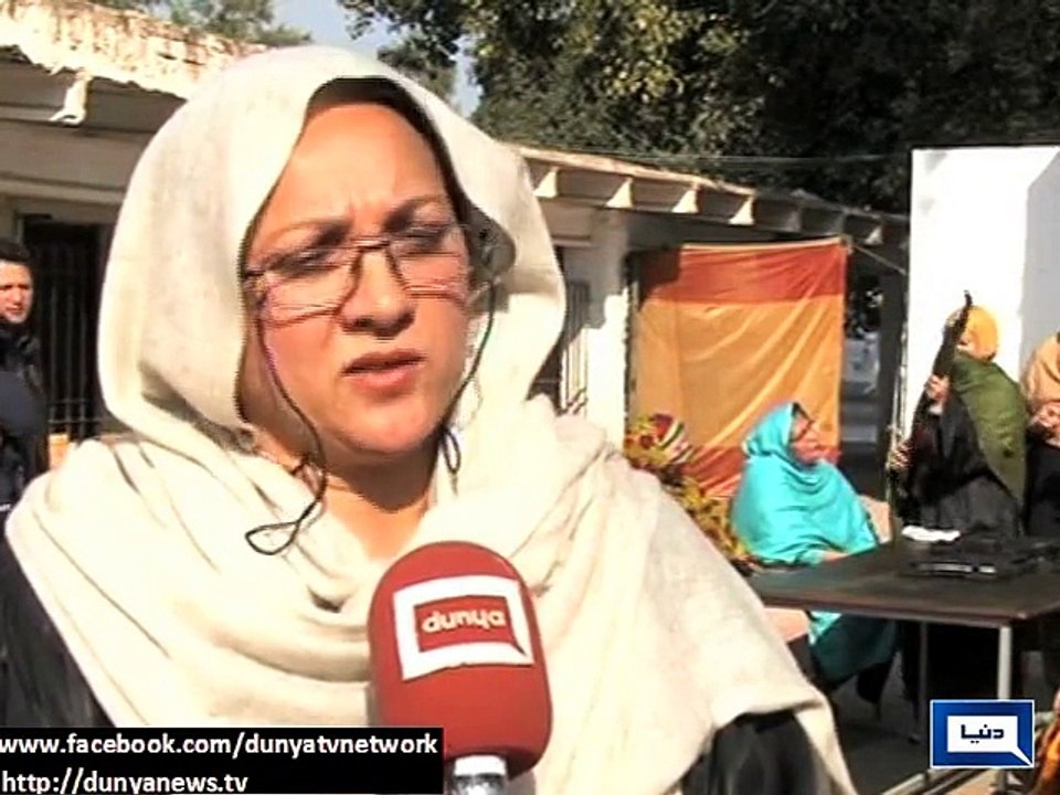 Female teachers being given weapons training