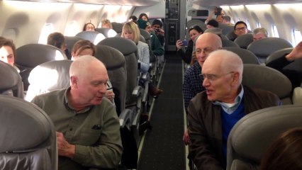 Talented barbershop quartet handles a plane delay by singing!