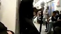 Crazy guy playing guitar in a train