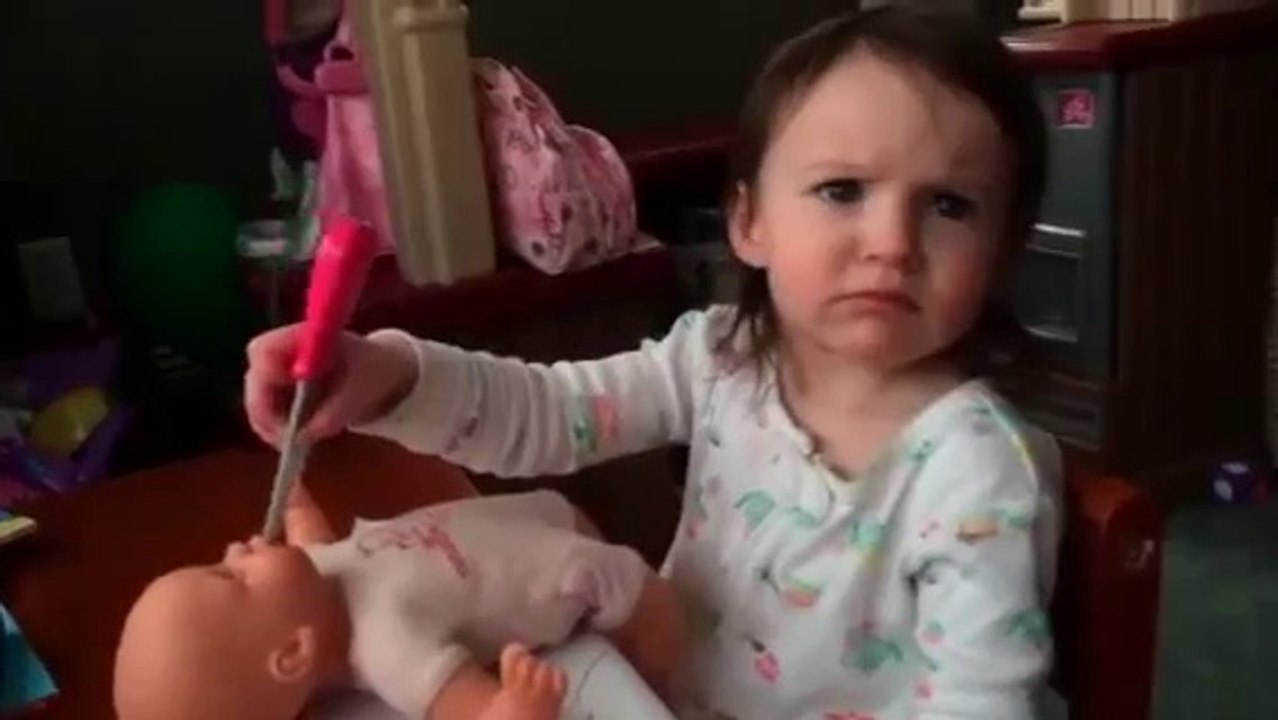 Creepy Young girl showing Murder whises on a puppet