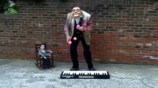 Beggar Juggling And Playing Piano At The Same Time