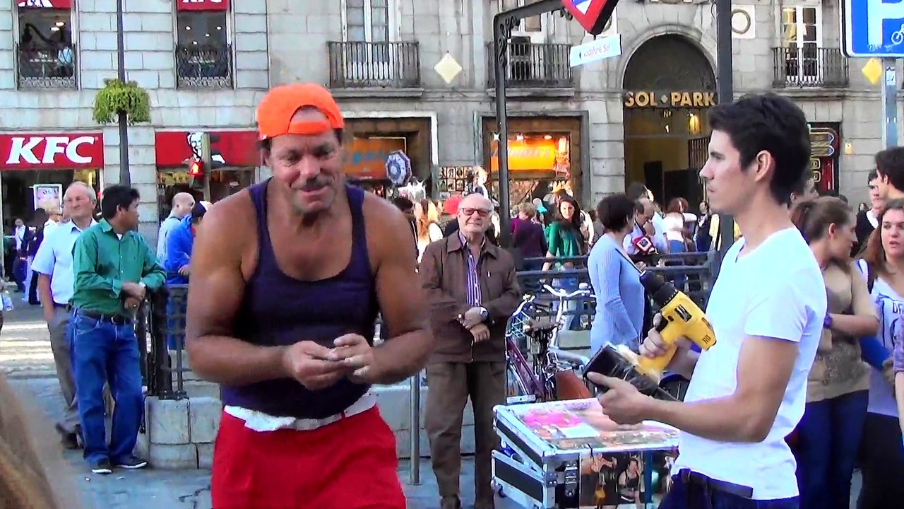 Street performer displays insane rotating drill stunt