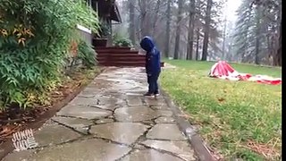 Kid discover rain puddle and gravity