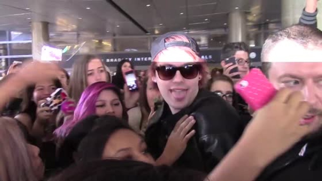 5 Seconds of Summer's Michael Clifford Gets Mauled by Girls at Airport