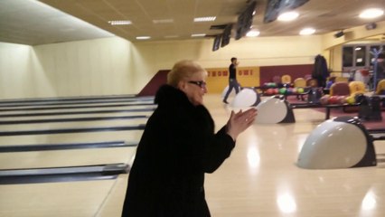 Funny Grandma playing bowling for first time get a strike!