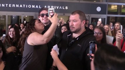 (Video) 5 Seconds Of Summer's Michael Clifford MOBBED And PULLED!