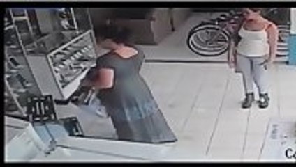 CCTV captures woman stuffing a plasma TV up her skirt