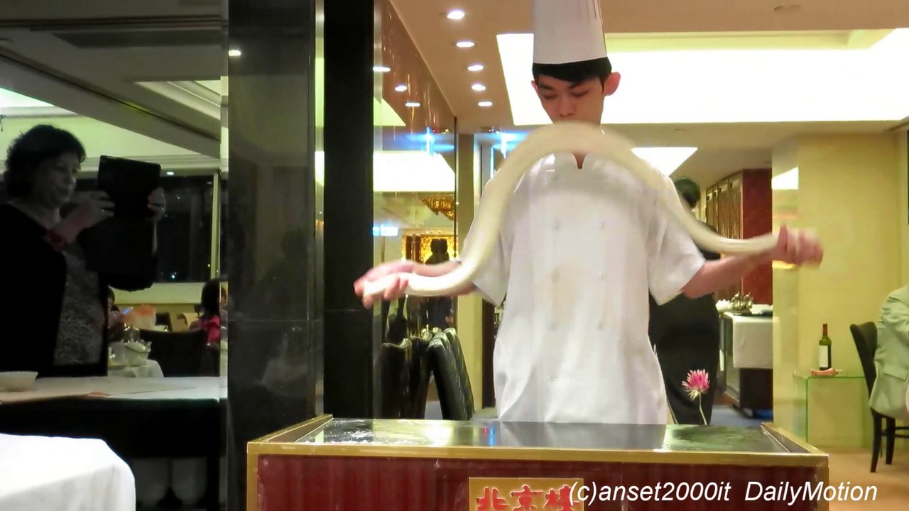 Chinese Chef Makes Noodles by Hand. Hand Pulled Noodles. Hong Kong Restaurant