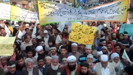 Protestors in Pakistan burn flags and demand beheadings