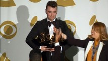 Sam Smith cradles his four Grammy's