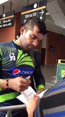 Umar Akmal giving Autograph with His Lucky Number 3