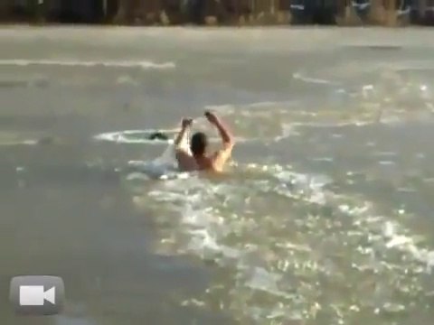 Courageous guy jumps in a frozen river to save his dog