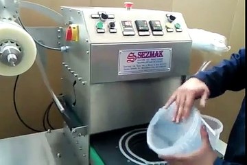 Plastic cup sealing machine