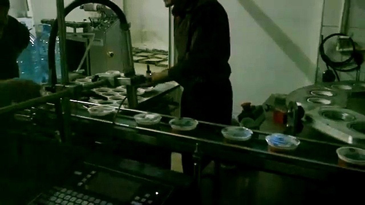 Plastic cup sealing machine