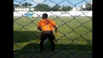 A Brazilian linesman entertains the crowd by dancing on the sidelines during a game