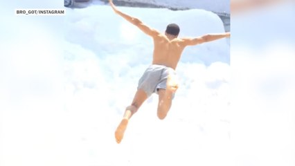 People in Boston jumping out of windows into snow
