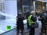 Dairy of Mad Men: Angry farmers spray milk on riot police in Brussels