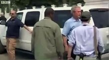 Bush wipes hand on Clinton in Haiti