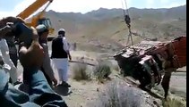 Recovering Truck From Mountain Valley With Crane
