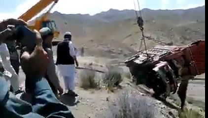 Recovering Truck From Mountain Valley With Crane
