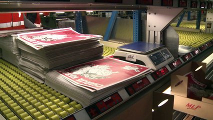 Charlie Hebdo team bites back with new issue