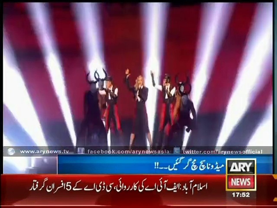 Madonna falls off stage during performance