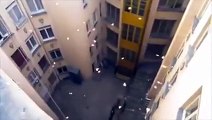 Throwing bucket of paper plane out of a buildinglook pretty cool