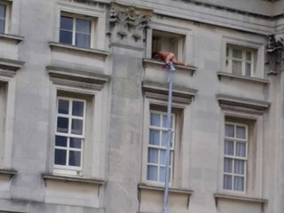 Man Climbing out of Buckingham Palace Window!
