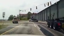 Semi truck drops huge beam.
