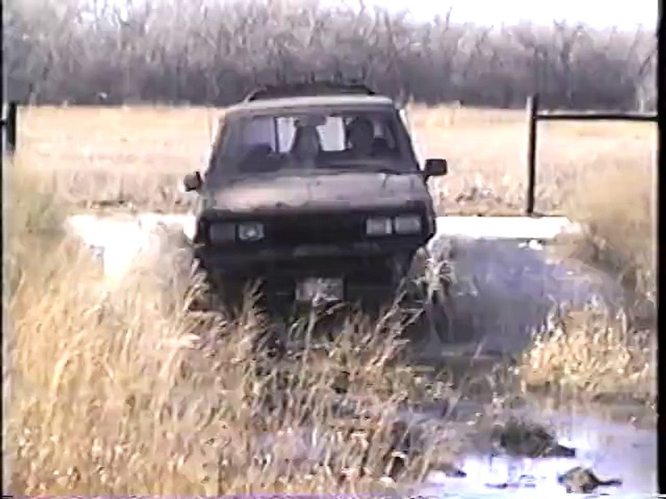 Crappy Nissan pickup mudding
