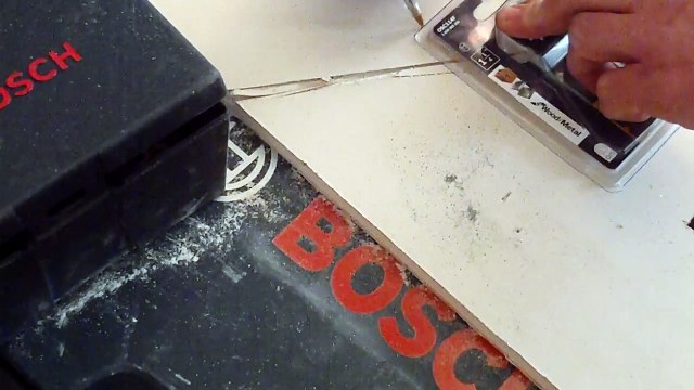 Showing How the BOSCH OMT 18v Cordless cuts drywall like butter