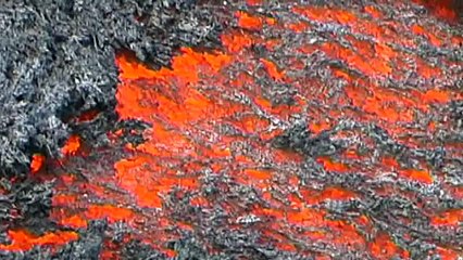 Download Video: Lava run man runs over glowing lava flow on volcano Etna