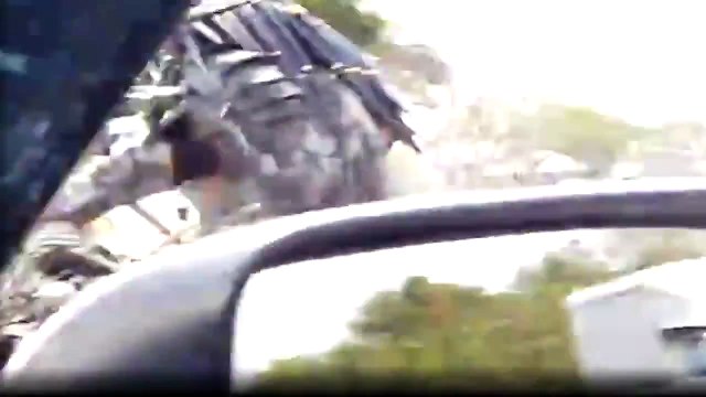 Guy dressed up in a Predator suit on a Predator style bike