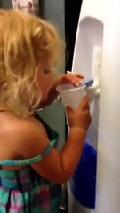 Little Girl Can't Figure Out Water Cooler