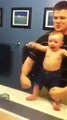 baby shows his muscles