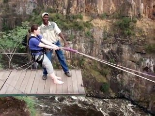 Guts Of Steel   Woman Jumps Off A Cliff Straight Towards A Surging River