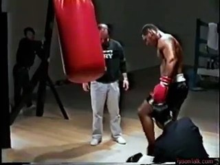 mike tyson showing his power on the heavy bag