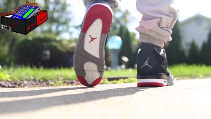 Jordan 4 Bred on feet