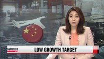 China lowers growth target, increases military budget