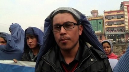 Afghan men wear burqas and march to support women's rights