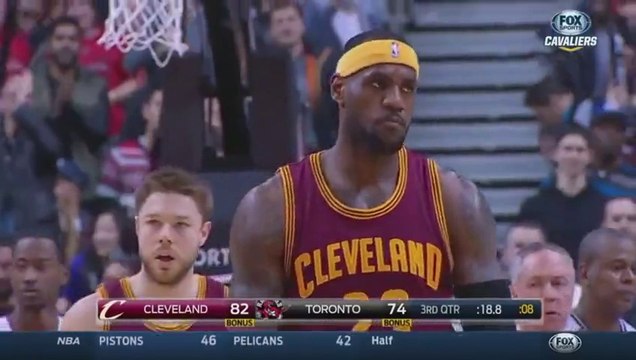 LeBron James tackled by Jonas Valanciunas during Cavaliers VS Raptors NBA game