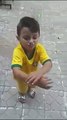 a cute boy dancing on an Arabic song