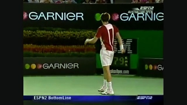 Roger Federer does a trick and hits ball boy__