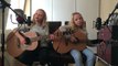 Two young girls singing 