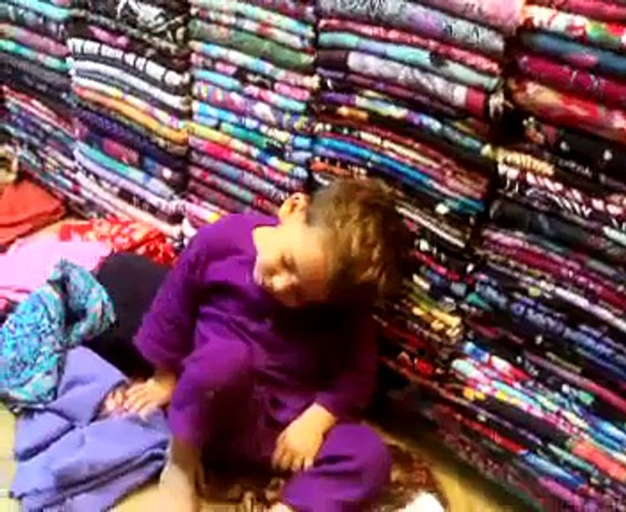 Cute baby faling during sleeping in shop